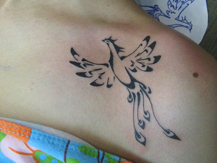 Rising Small Black Ink Phoenix Tattoo On Shoulder