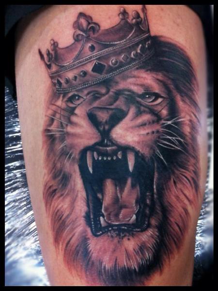 Roaring Lion With Crown Tattoo On Thigh