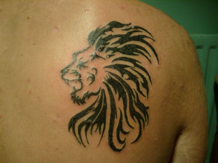Small Tribal Lion Tattoo On Back Shoulder