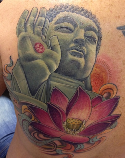Sweet Pink Lotus Floating In Blue Water And Lord Buddha Tattoo