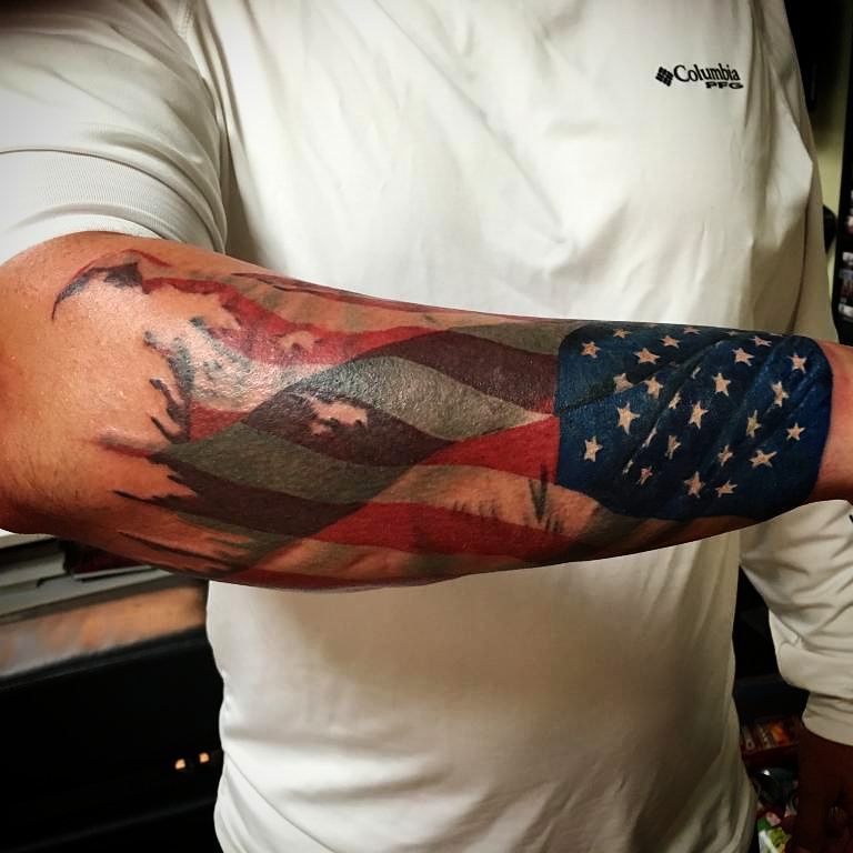 Tattered American Flag Tattoo On Forearm