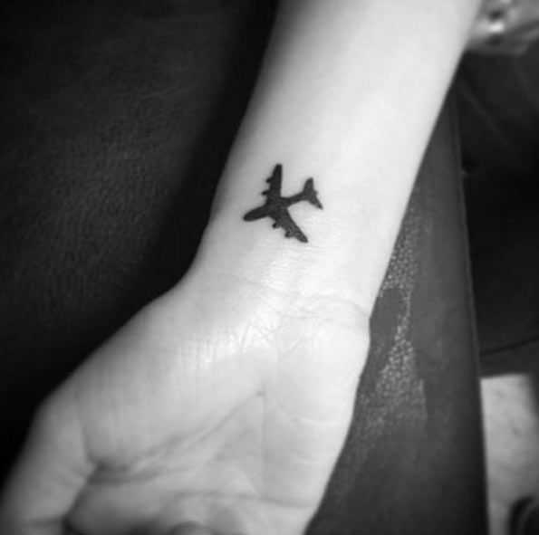 Tiny Airplane Travel Tattoo On Wrist