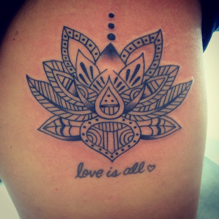 Tribal Lotus Flower And Love Is All Lettering Tattoo