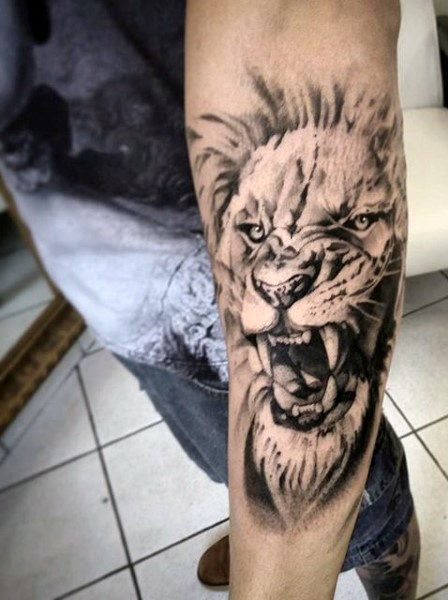 White And gray Ink Lion Tattoo On Outer Forearm