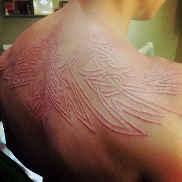 White Ink Phoenix Tattoo On Upper back
