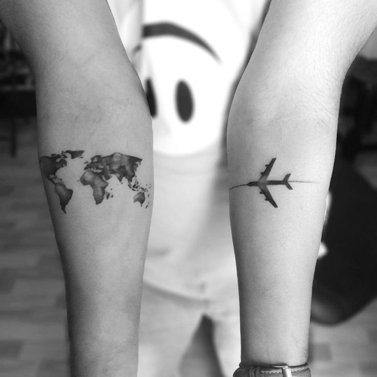 World Map and Airplane On Different Arms Reflecting Fly Across The World Travel Tattoo