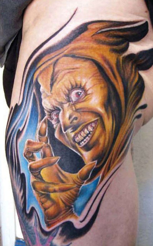 Yellow Blue And Black Color Ink Demon Tattoo On Leg