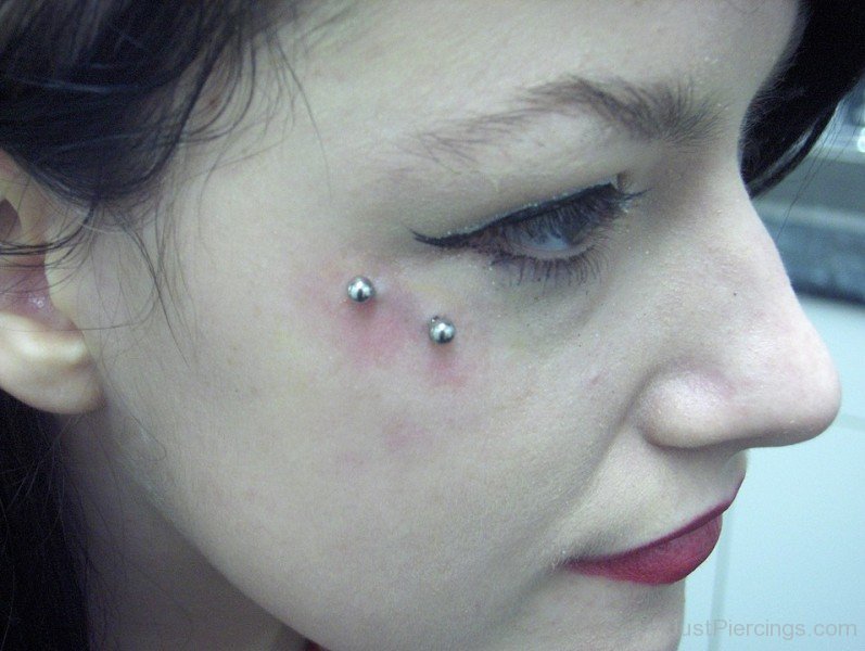 Anti Eyebrow Surface Piercing With Silver Barbel