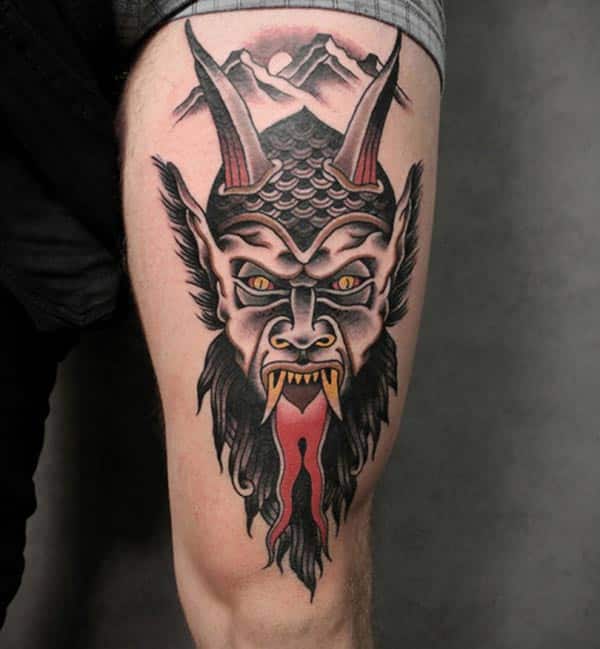 Black & Grey Dark Devil Face With Horns & Red Tongue Tattoo On Thigh