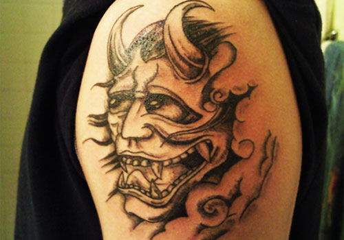 Black & Grey Small Devil Tattoo On Shoulder For Men
