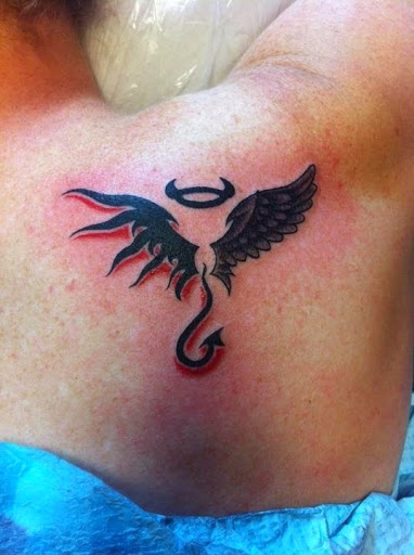 Black Haloed Devil Tattoo On Girl Back Shoulder