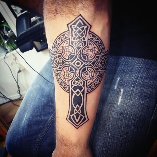 Black Ink Tribal Celtic Cross Tattoo On Man Forearm