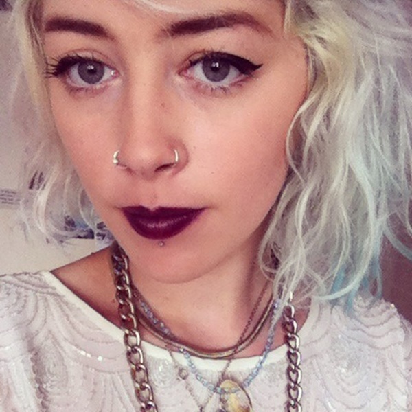 Blonde Girl With Nostril Nose Ring Piercing On Both Sides