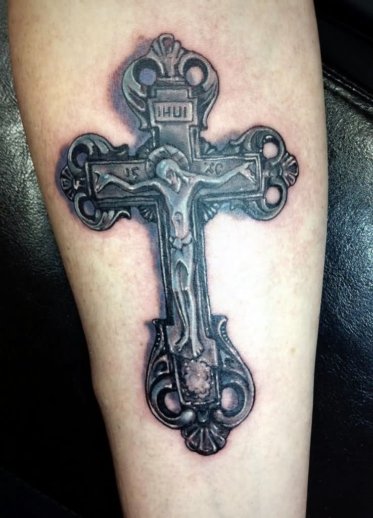Classic Dark Metallic Christ Cross Tattoo On Forearm by Kononart