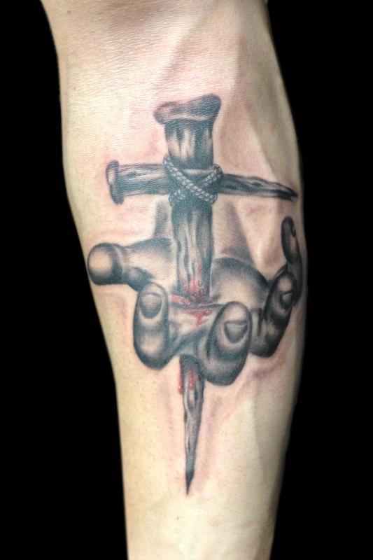 Grey Ink Cross Through Hand Tattoo On Forearm by Ricky Borchert