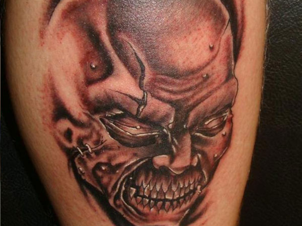 Grey Ink Disappointed Devil Tattoo Design