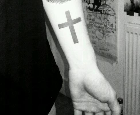 Grey Ink Simple Dark Cross Tattoo on Forearm