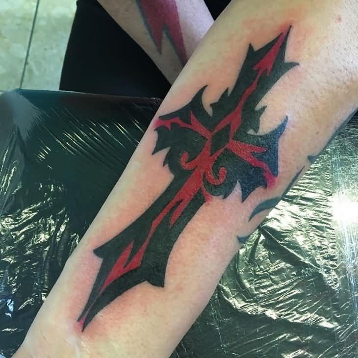 Red & Black Tribal Cross Tattoo on Forearm