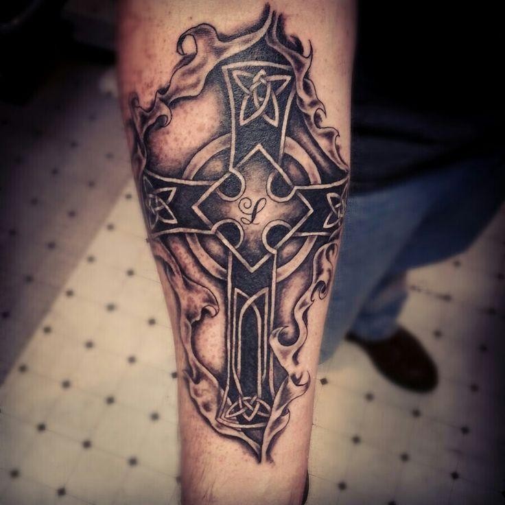 Ripping Skin Black Celtic Cross Tattoo On Forearm