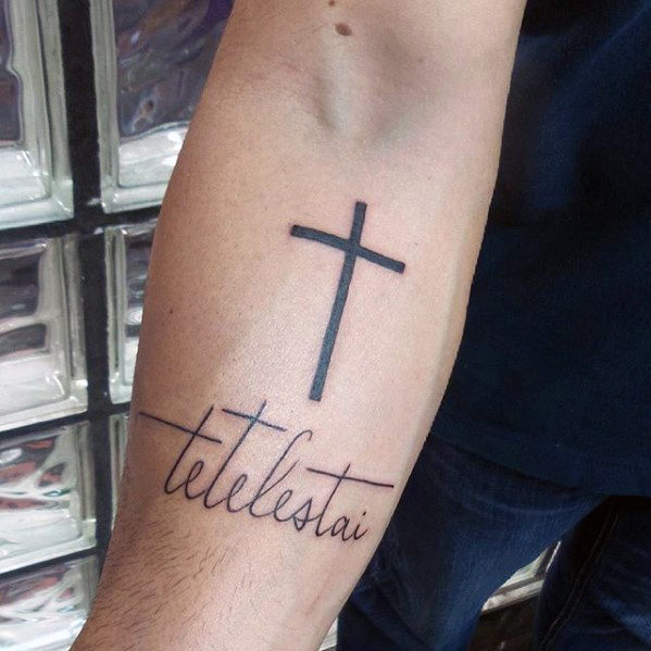 Simple Black Cross With Wording Tattoo On Forearm1