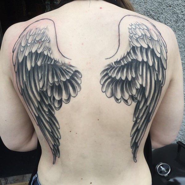 Beautiful Black & Grey Shade Angel Wings Tattoo On Girl’s Back