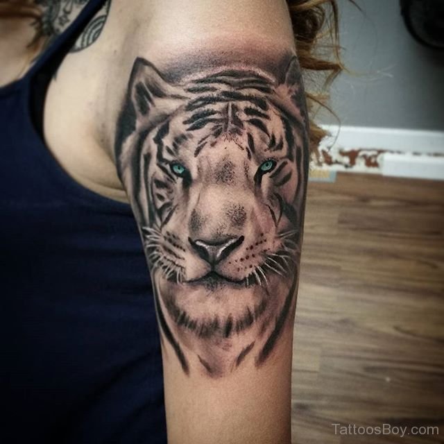 Beautiful Blue Eyes White Tiger Tattoo On Bicep For Girls