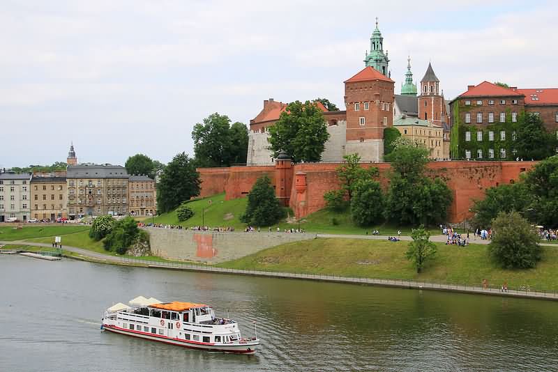 Boat In River And Wawel Castle View