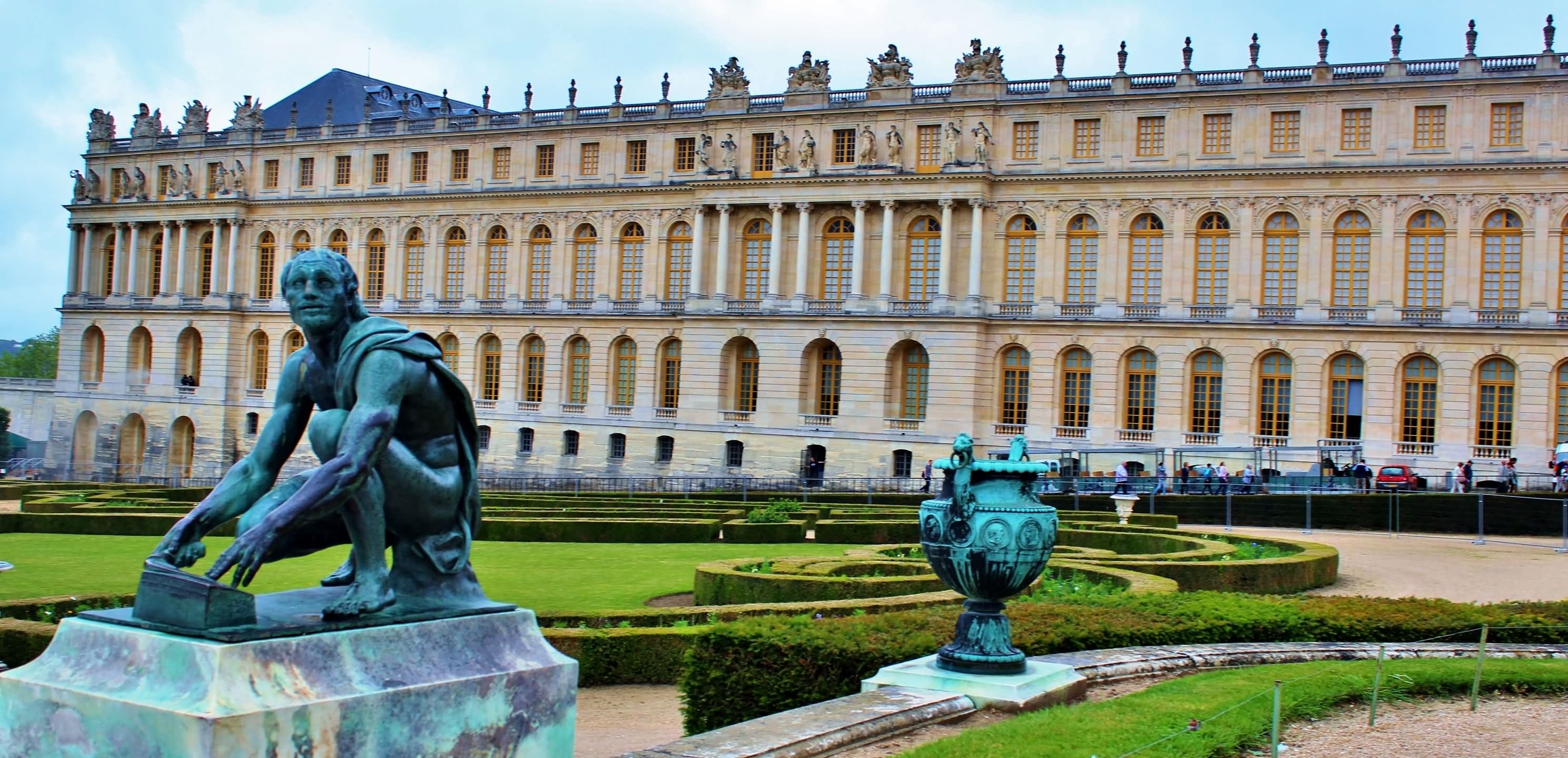 Bronze Statue And The Palace of Versailles