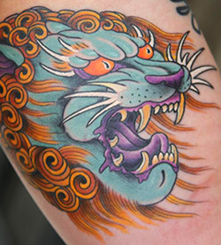 Colorful Japanese Lion Face Tattoo Design
