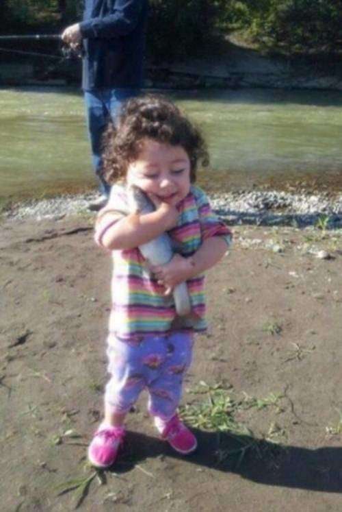 Cute Kid Loving Fish Funny Picture