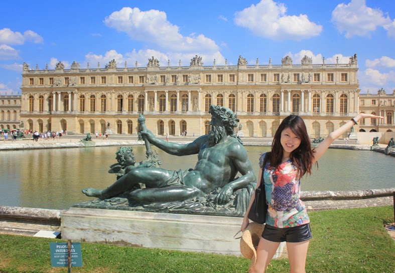 Girl Posing With Bronze Statue At the Palace of Versailles