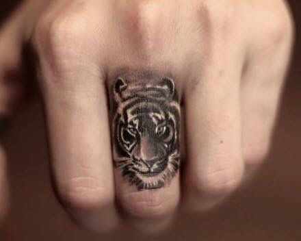 Grey And Black Tiger Head Tattoo On Finger