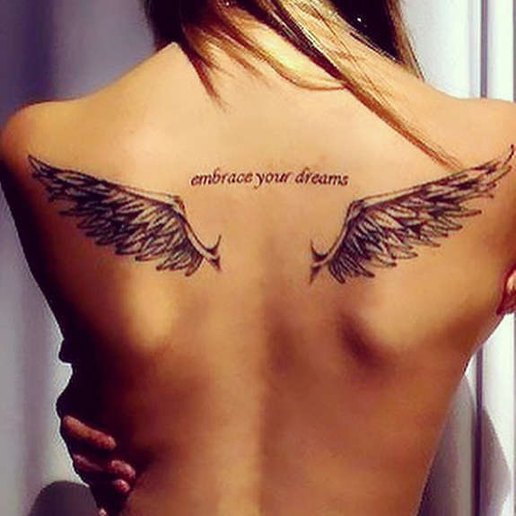 Grey Ink Angel Wings Tattoo With Wording ‘Embrace your Dreams’ On Girl Back