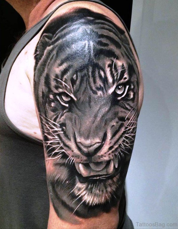 Grey Ink Realistic Tiger Tattoo On Half Sleeve Displays Your Inner Strength