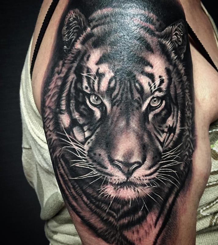Grey Ink Realistic Tiger Tattoo On Half Sleeve