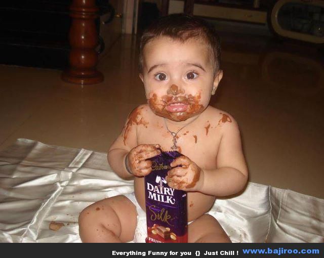 Kid Eating Chocolate In Funny Style