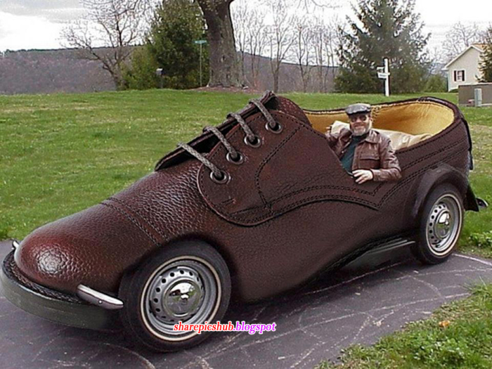 Man Sitting In Funny Shoe Shaped Car