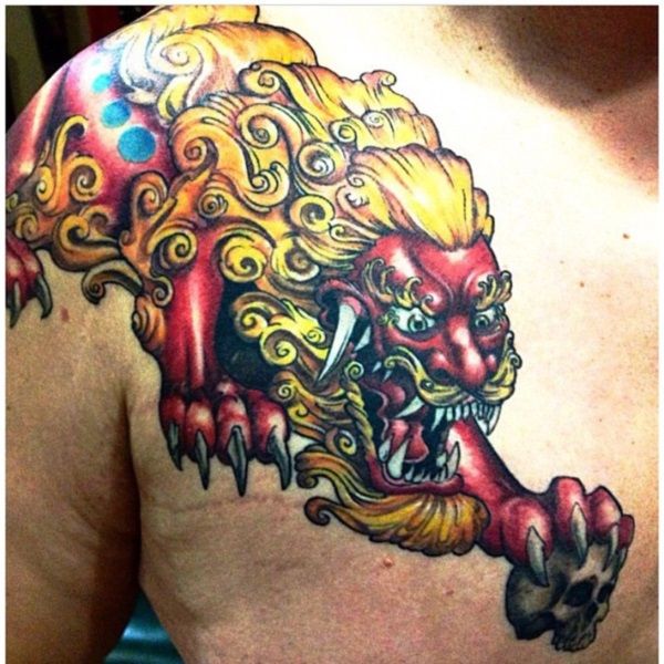 Red & Yellow Japanese Lion Tattoo On Front Shoulder