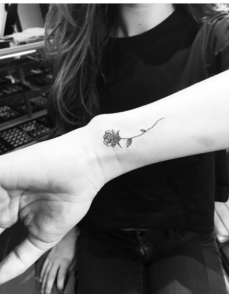Small Black Rose Tattoo With Stem On Wrist