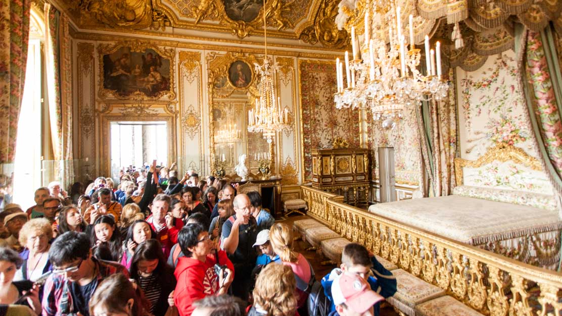 Tourists Inside The Room Of The Palace Of Versailles