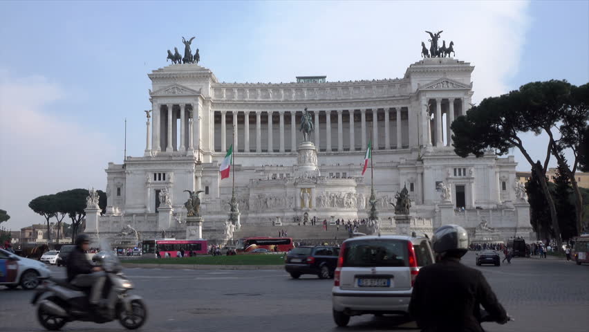Traffic Passing In Front Of The Victor Emmanuel II Monument