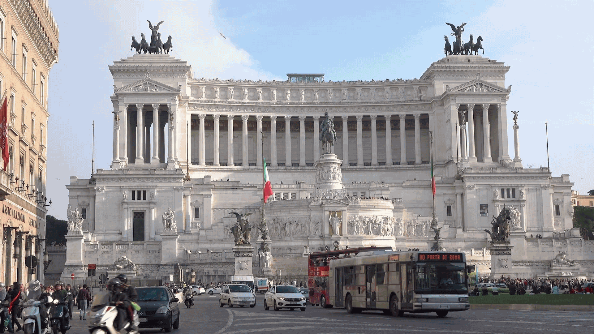 Traffic drives Round Piazza Venzia In Front Of Victor Emmanuel II Monument