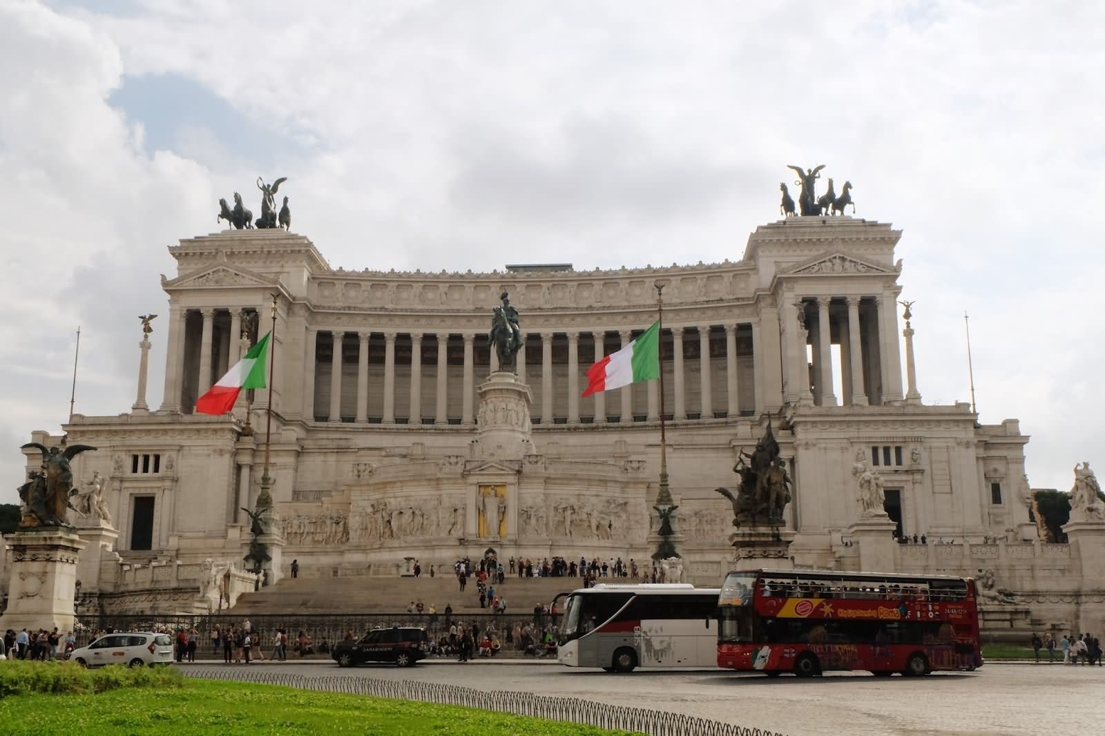 Waving Italian Flag In front Of Victor Emmanuel II Monument