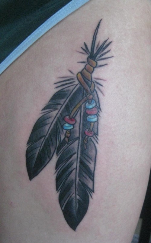 Amazing Black Ink Indian Eagle Feathers Tattoo On Thigh For Girls