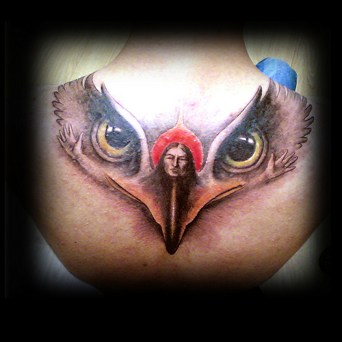 Amazing Combination Of Women & Eagle Eyes Tattoo On Girl Upper Back