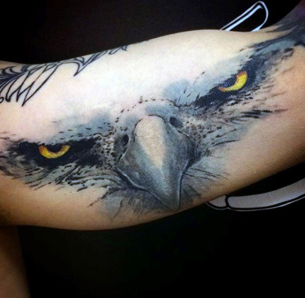 Angry Eagle Eyes & Beak Tattoo On Bicep