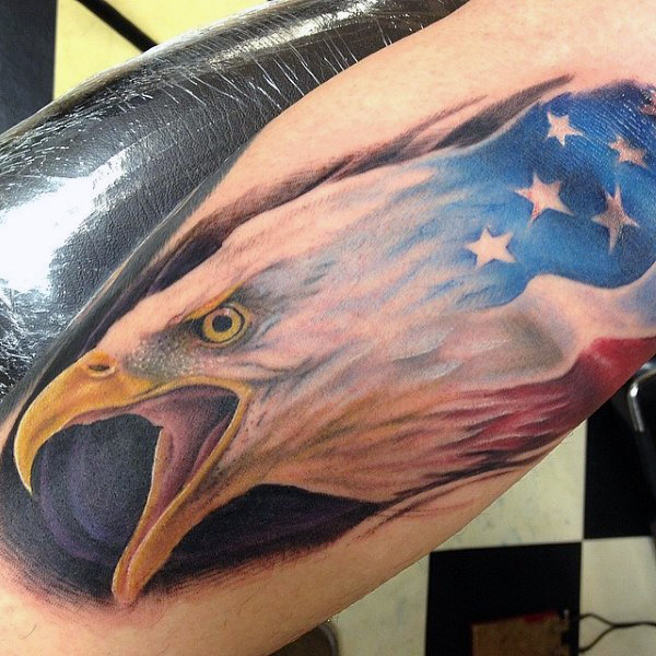 Angry Flying American Flag Colored Bald Eagle Tattoo