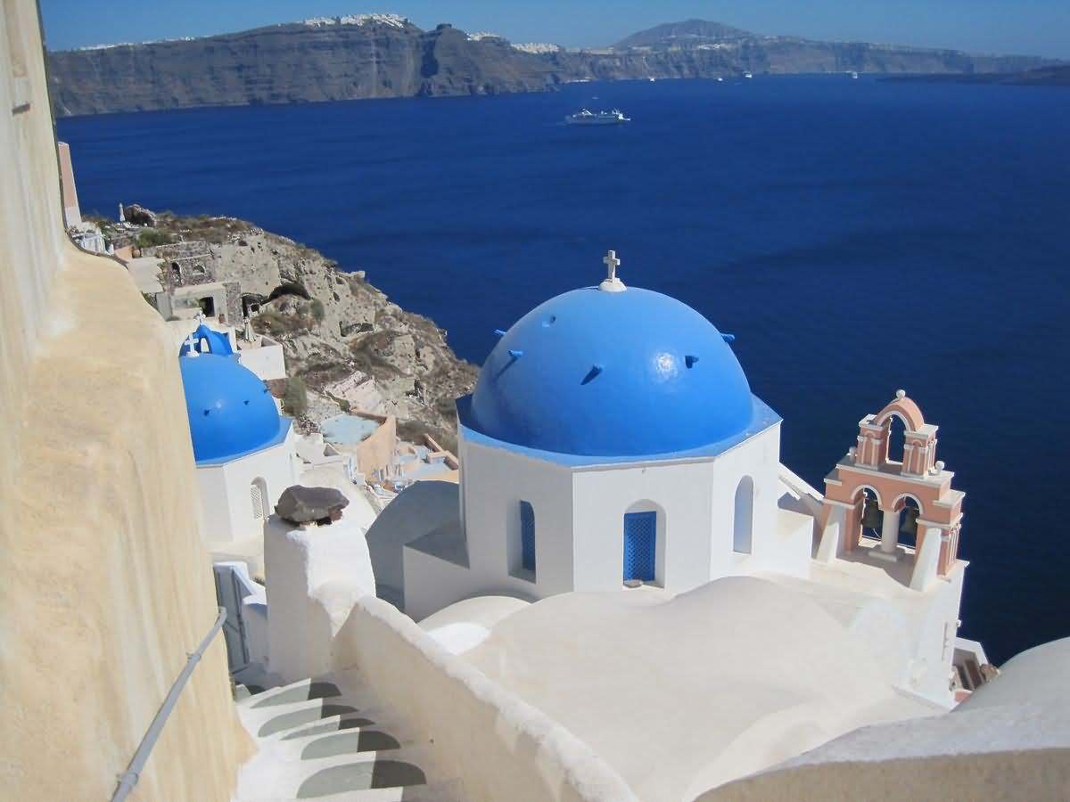 Beautiful View Of Blue Dome Church And Sea In Greece