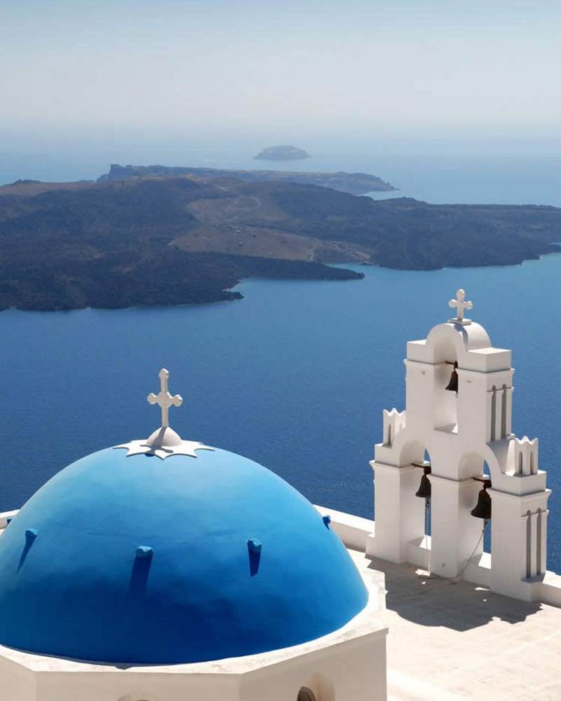 Beautiful View Of The Blue Domed Church In Santorini