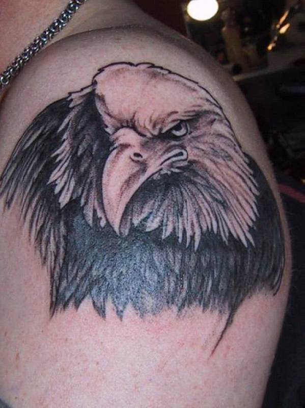 Black & White Angry Bald Eagle Head Tattoo On Man Shoulder
